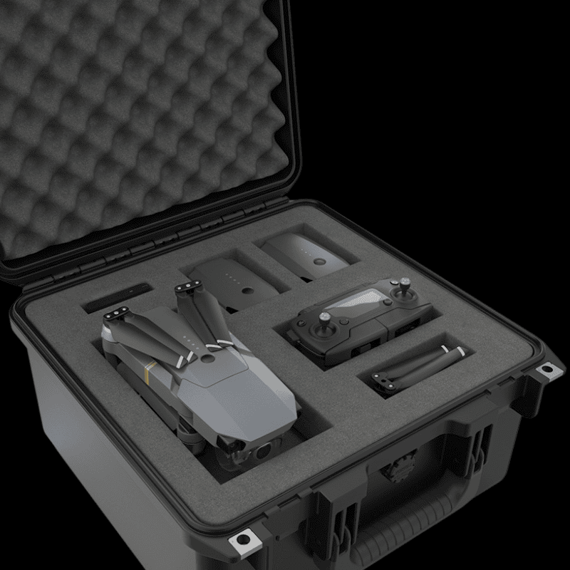 Compact drone kit with foldable quadcopter, remote controller, spare batteries, and propellers stored in a custom protective hard case.