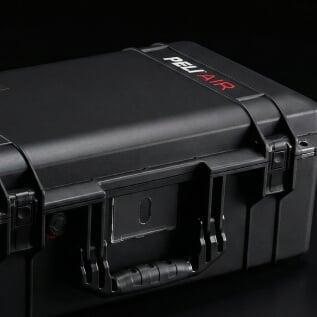 Detail view of a black Peli Air case featuring a lightweight shell, pressure valve, and sleek latch system.