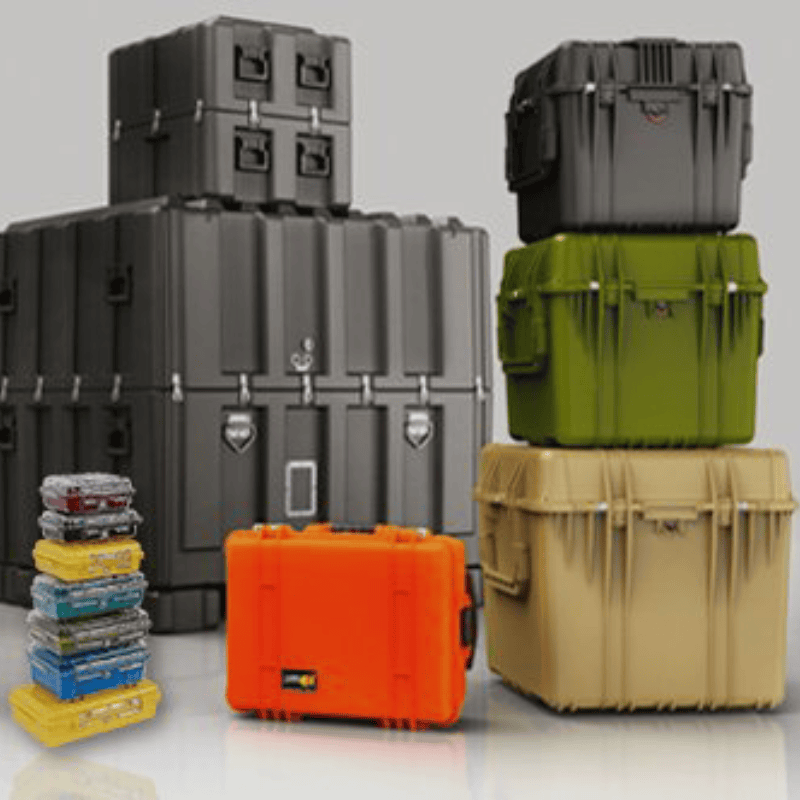 Assorted stack of Peli-style hard cases in various sizes and colors, designed for rugged transport and protective equipment storage.